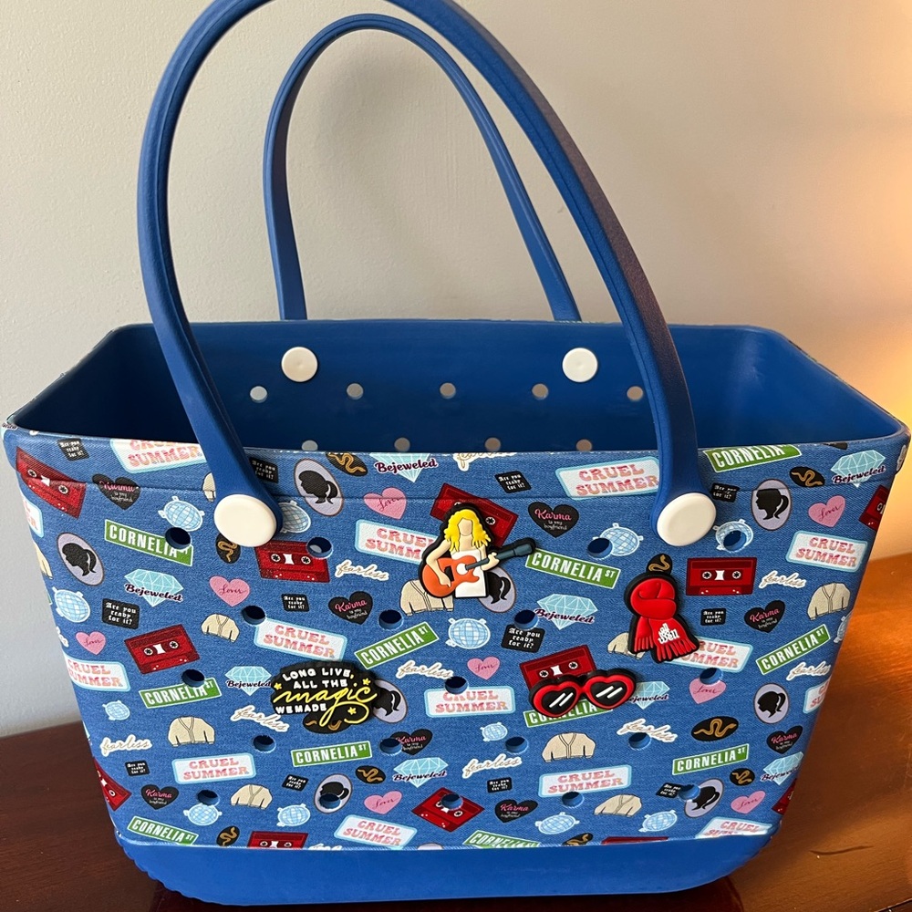 Blue “Bogg” style sturdy tote with Taylor Swift inspired graphics and 4 charms.